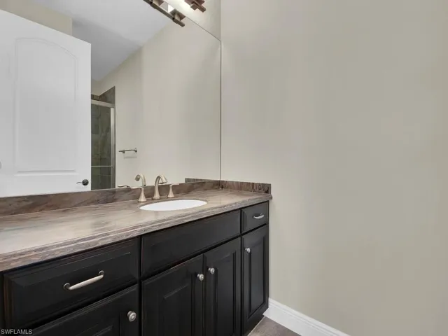 Bathroom with vanity and walk in shower