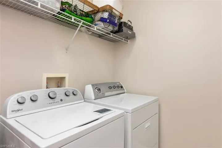 Washroom featuring washing machine and clothes dryer