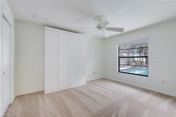 Guest Bedroom/Office w Queen Murphy Bed, Walk-in closet, fresh carpet & views to Pool