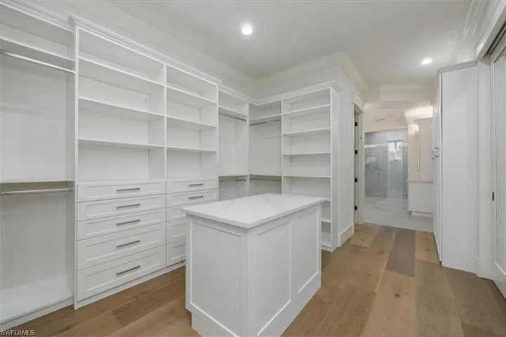 Walk in closet featuring light wood finished floors