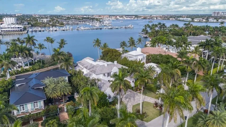 Aerial view of property's location featuring a nearby body of water