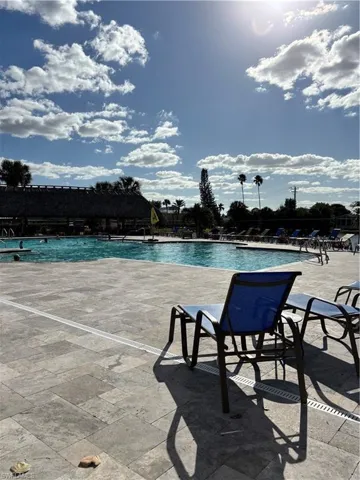 Community pool with a patio