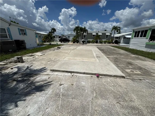 View of vehicle parking featuring a residential view