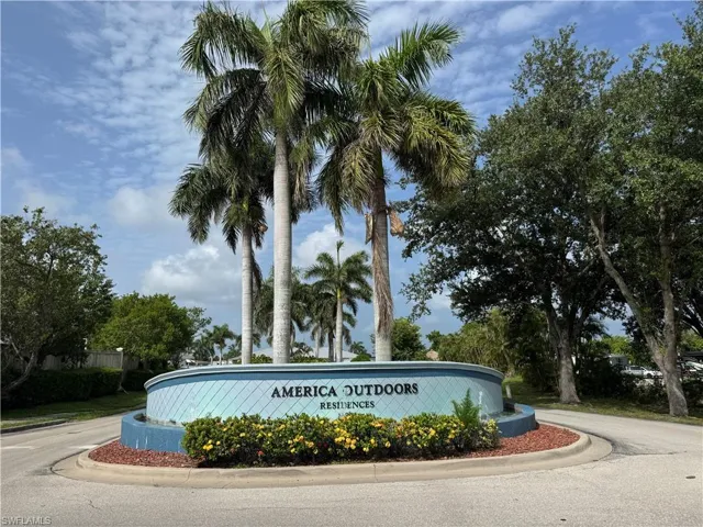 Community / neighborhood sign with curved driveway