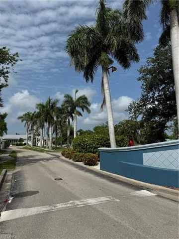 View of asphalt street with curbs