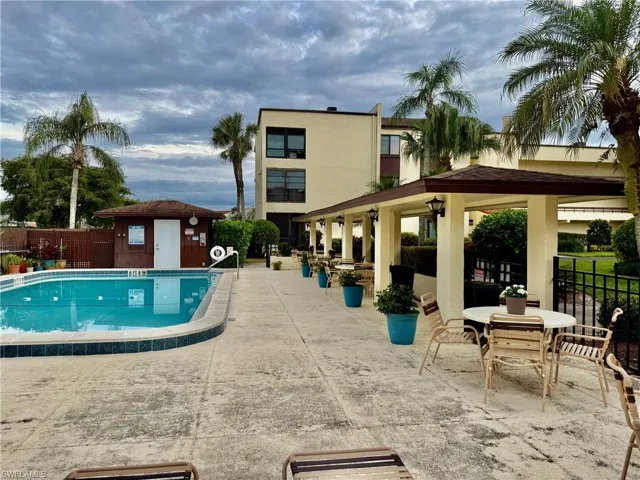 Community pool with a patio area