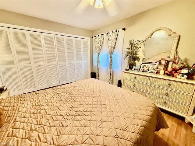 Bedroom featuring a closet, ceiling fan, and light wood-type flooring