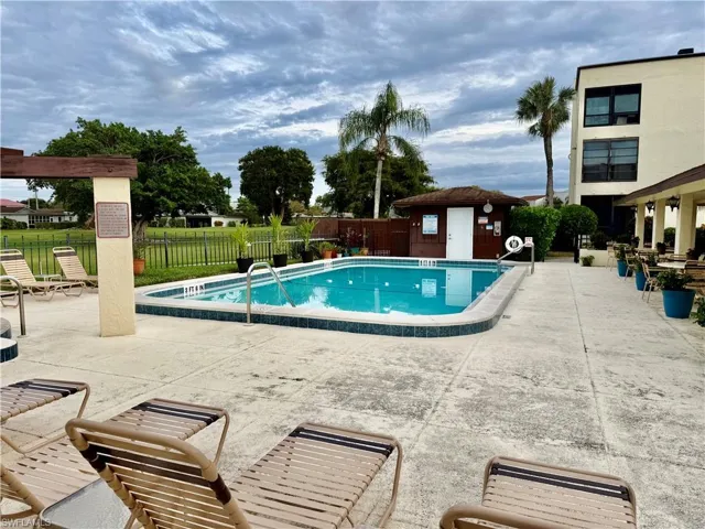 Community pool featuring a patio