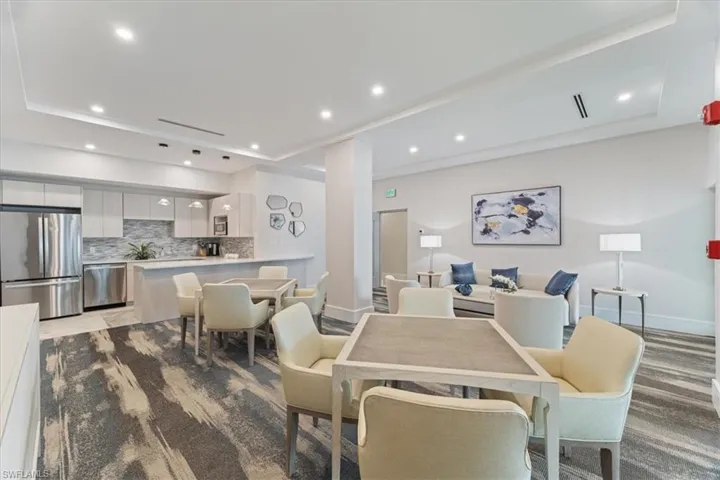 Dining space featuring a raised ceiling and recessed lighting
