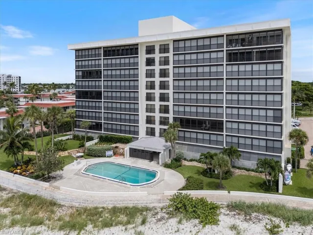 View of apartment building / complex with a community pool