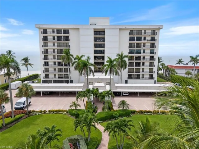 View of apartment building / complex with a water view