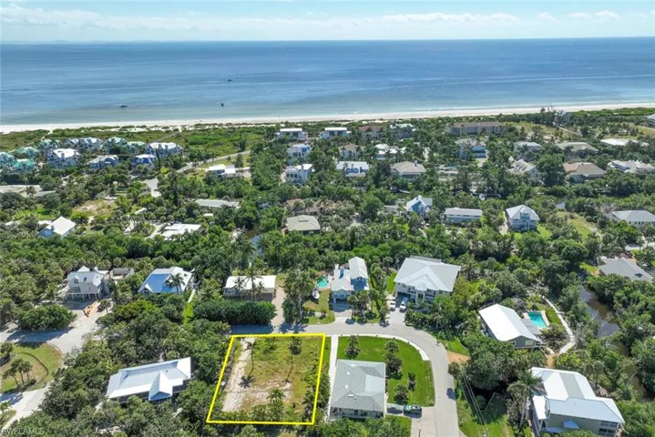 Aerial view of property's location featuring nearby suburban area and property parcel outlined