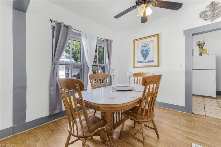 Dining room featuring ceiling fan and light wood-type flooring