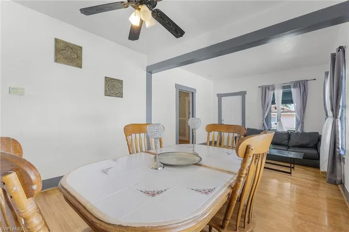 Dining room with light wood-type flooring and ceiling fan