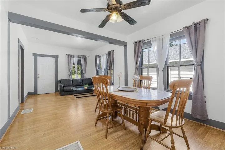 Dining area featuring ceiling fan and light hardwood / wood-style flooring