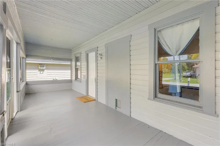 Unfurnished sunroom featuring a healthy amount of sunlight