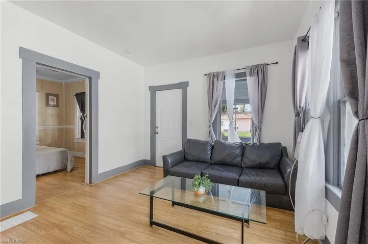 Living room with light wood-type flooring