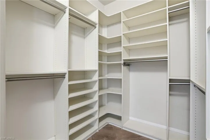 Nicely appointed primary suite closet.