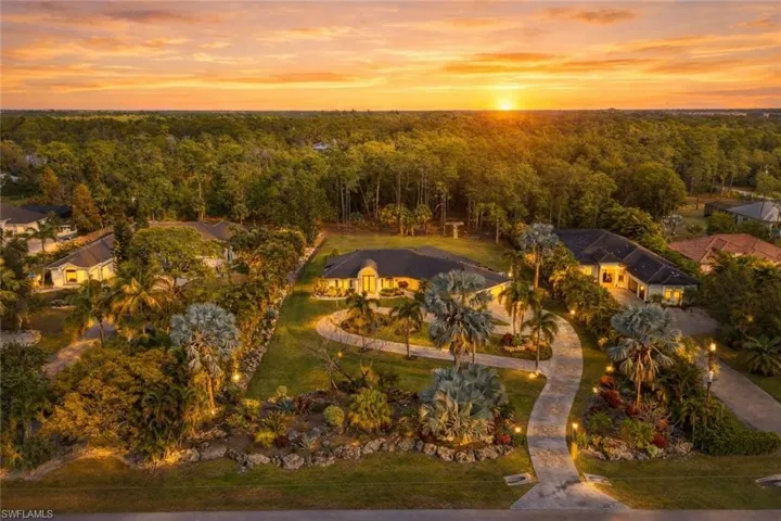 Aerial view at dusk of a residential view and a forest view