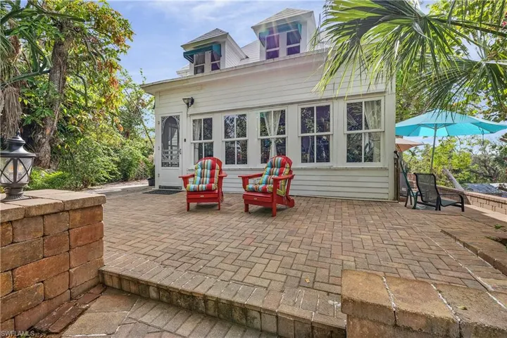 Rear view of property featuring a patio area