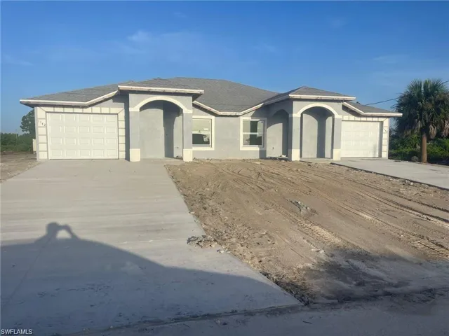 View of front of property with a garage