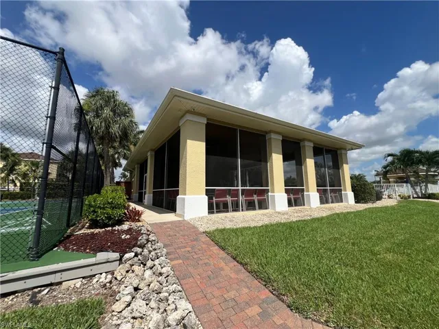 Rear view of house with a sunroom