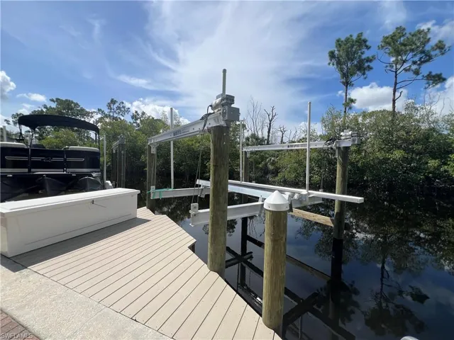 Dock with boat lift and a water view