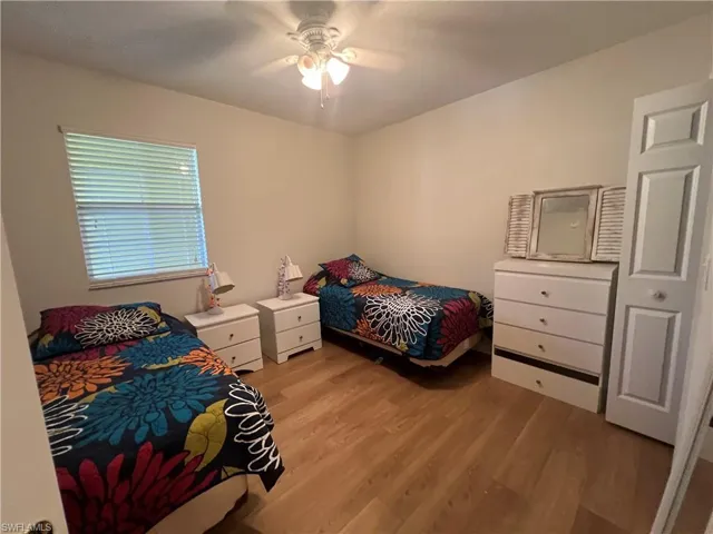 Bedroom featuring light wood-style flooring and ceiling fan