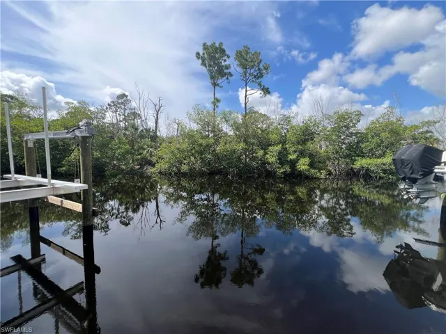Dock featuring a water view and boat lift