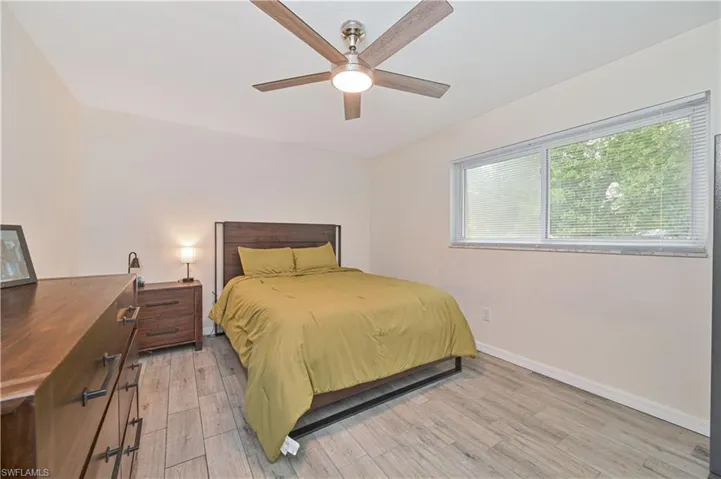 Bright interior space featuring light-toned walls and wood-finish flooring