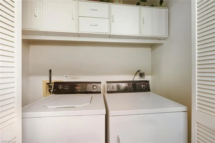 Laundry area featuring independent washer and dryer