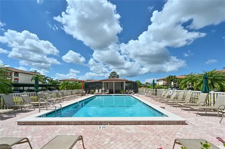 Community pool featuring a patio