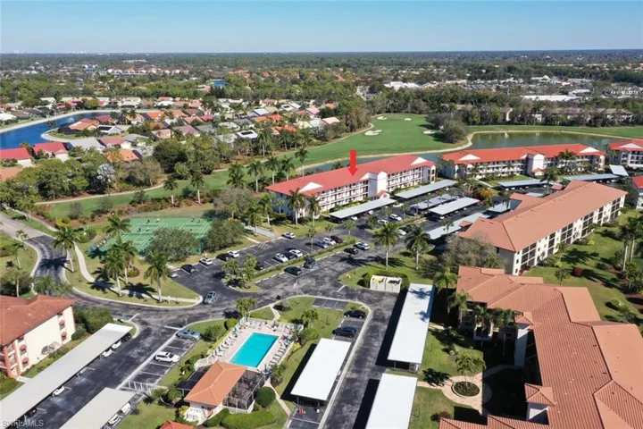 View of property location featuring a large body of water and a golf course