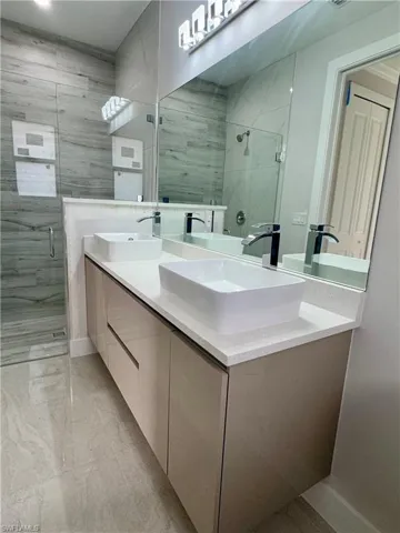 ACTUAL PROPERTY- Master Bathroom with vanity and a shower with shower door