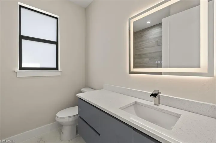 Bathroom featuring vanity and toilet