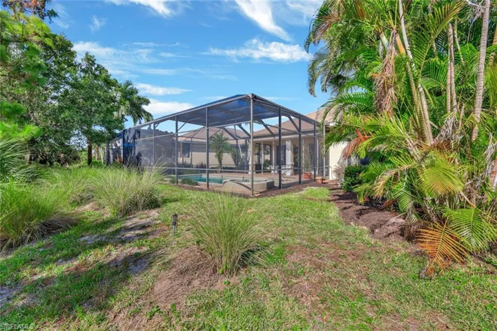 View of yard featuring a lanai