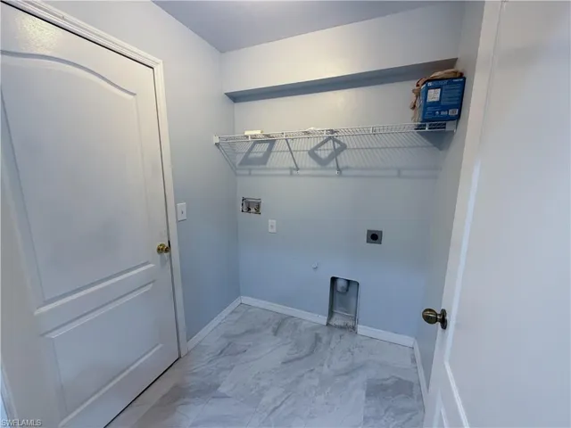 Laundry room with hookup for a washing machine, electric dryer hookup, and hookup for a gas dryer