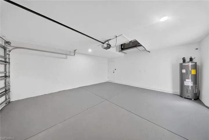Garage featuring water heater