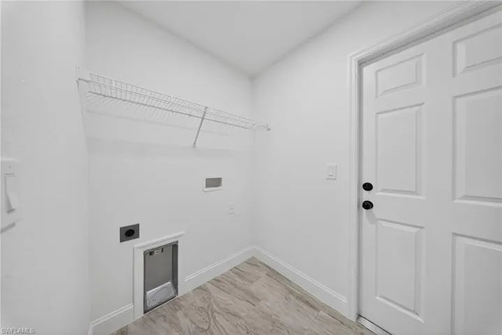 Laundry area featuring hookup for an electric dryer and washer hookup