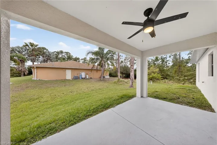 View of patio featuring ceiling fan
