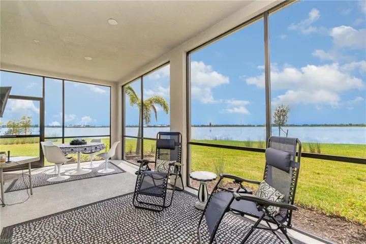 Sunroom featuring a water view
