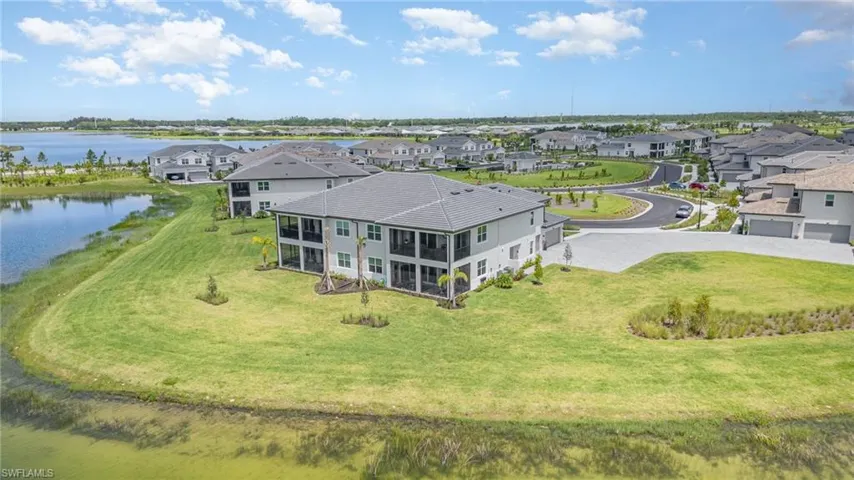 Aerial view of residential area with a large body of water