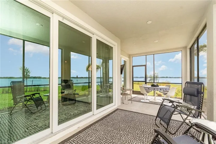 Sunroom with a water view