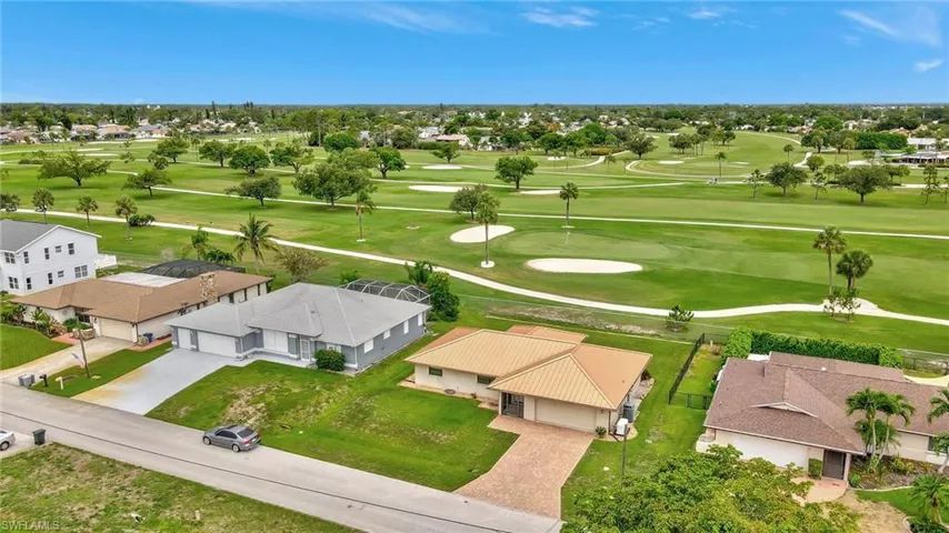 Aerial view of residential area with a golf course
