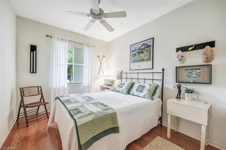 Bedroom with wood finished floors and a ceiling fan