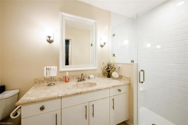 Bathroom with vanity and a stall shower