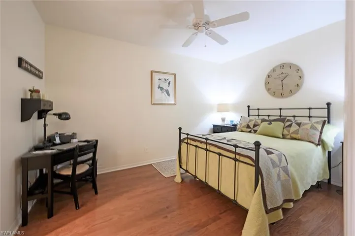 Bedroom with wood finished floors and ceiling fan