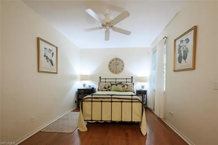 Bedroom with wood finished floors and ceiling fan