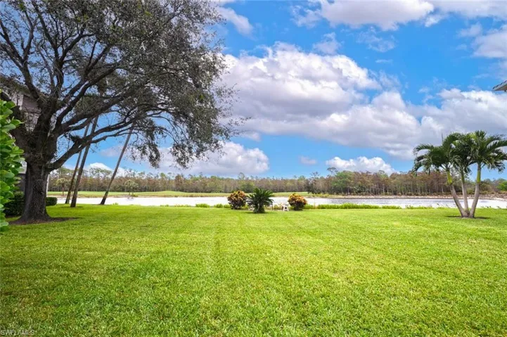 View of green lawn with a water view