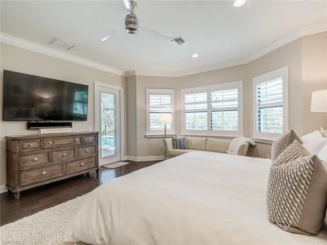 Bedroom featuring crown molding, access to outside, dark wood finished floors, recessed lighting, and ceiling fan